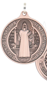 Front of the St. Benedict Medal showing St. Benedict with Cross and Rule